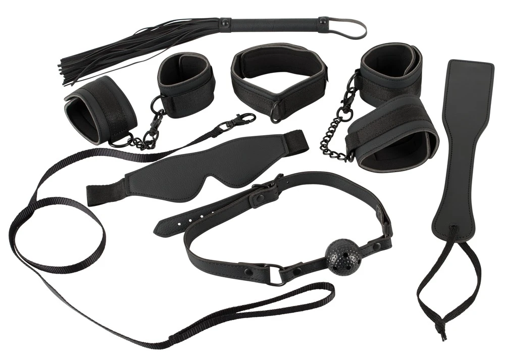 Bad Kitty Halsband mit Leine, Augenmaske, Mundknebel, Peitsche, Paddel, Hand- und Fußfesseln sind aus Lederimitat .