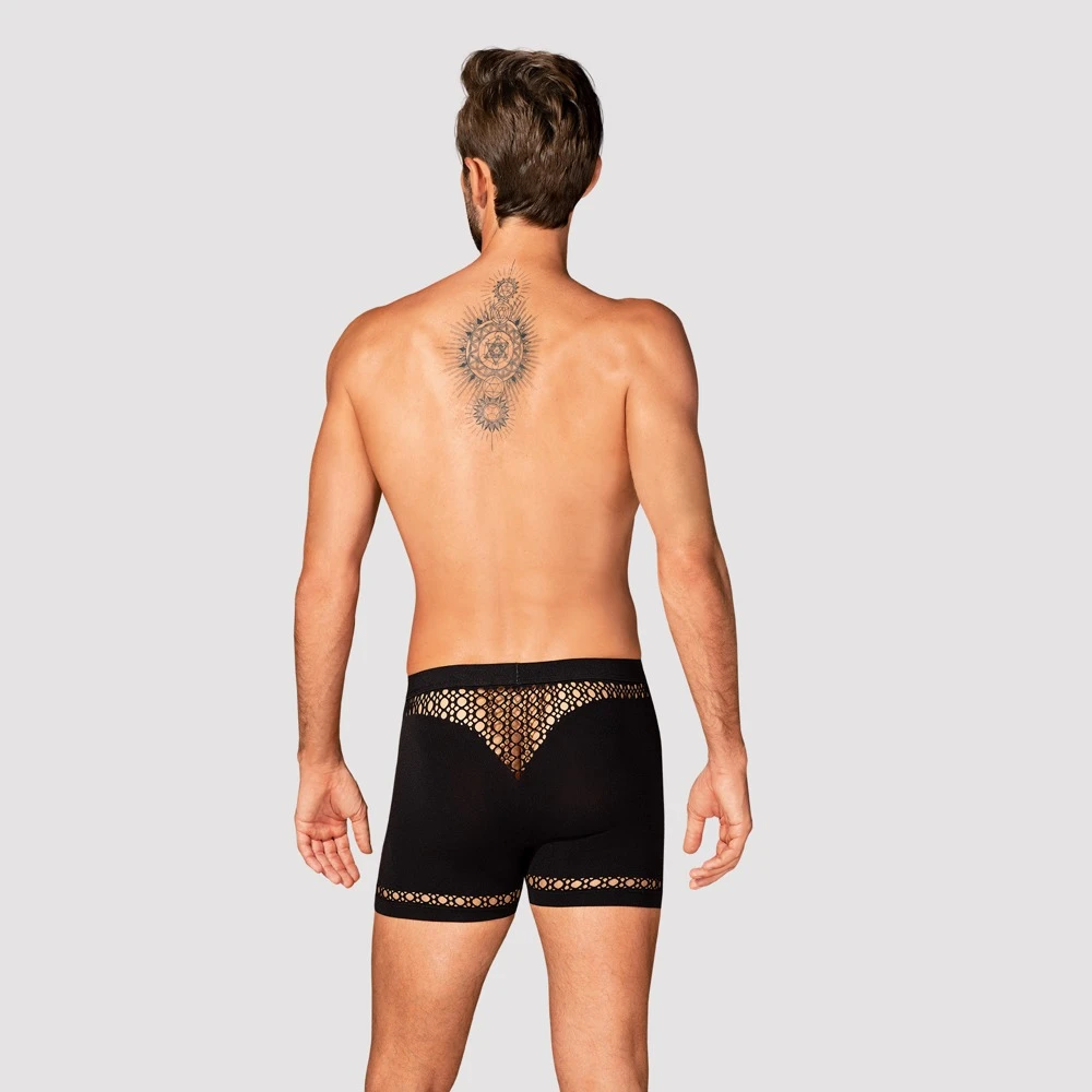 Obsessive Schwarze Pants mit hautdurchblitzenden Cut-outs in Netzoptik an Bund und Bein. Aus weichem Stretchmaterial mit bequemem Bundgummi.