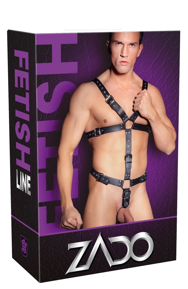 Harness aus schwarzen, nietenbesetzten Lederriemen und stählernen Verbindungsringen. Mehrfach mit Schnallenverschlüssen verstellbar.